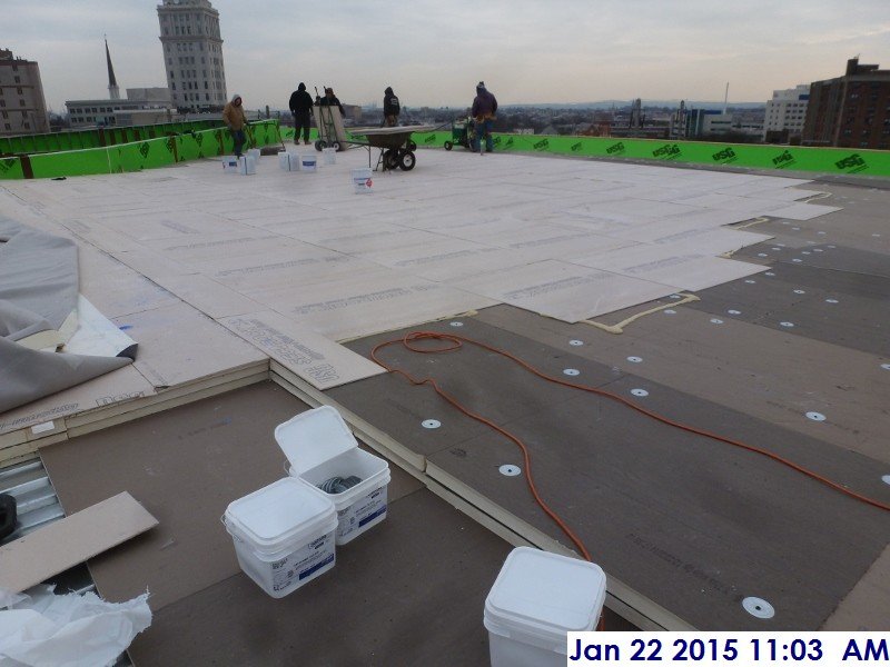 Continued roof installing at the high roof Facing East 1
